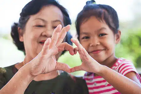 AsianFamily Asian Grandmother and her adopted grandchild